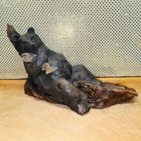 
              Bear Basking on Log Holding Fish Figurine
            