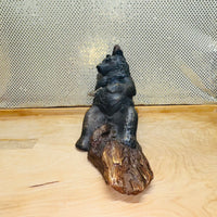 
              Bear Basking on Log Holding Fish Figurine
            