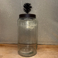 
              Glass Jar with Metal Pine Cone Lid
            