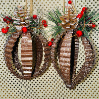 
              Crinkle Metal Ornament with Pine Cones and Berries
            
