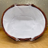 
              Stained Cotton-lined Oval Willow Basket
            