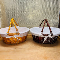 
              Stained Cotton-lined Oval Willow Basket
            