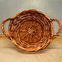 
              Stained Wicker Round Basket with Braided Handles
            